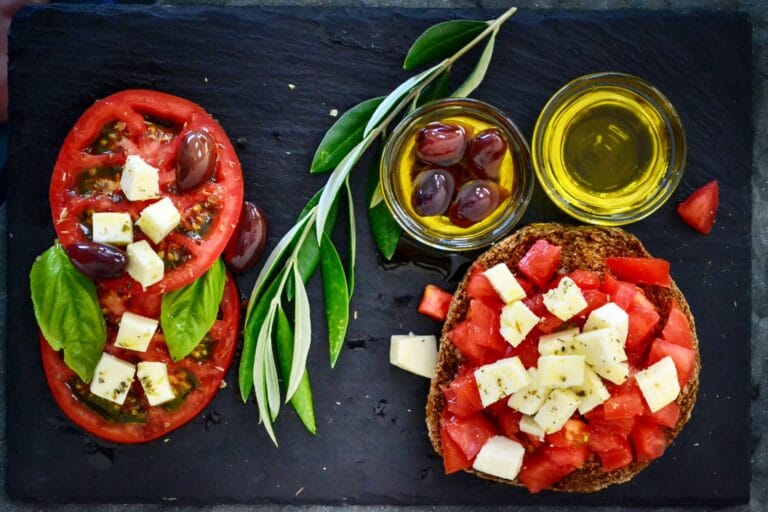 Mediterranean-style tomato salad with olives, olive oil, basil and wholegrain bread.